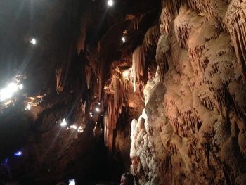 Low angle view of illuminated cave