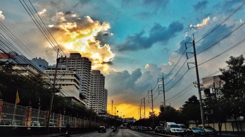 City street against cloudy sky