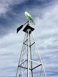 Low angle view of windmill against sky