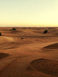 Scenic view of desert against clear sky