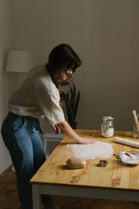 Young woman making christmas cookies