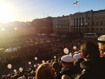 Crowd at town square in city