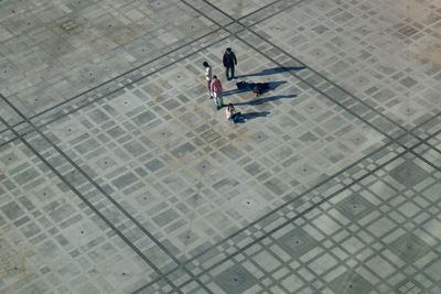 High angle view of people sitting at town square
