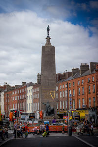 Buildings in city against sky