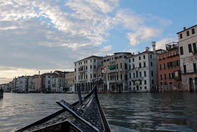 Gondola on grand canal in city