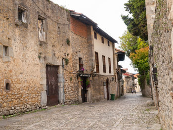 Footpath amidst buildings in town