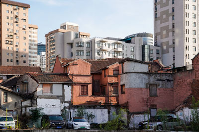 Buildings in city against sky