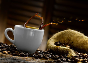 Close-up of coffee cup on table
