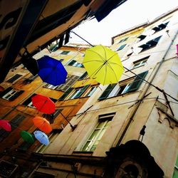 Low angle view of multi colored buildings against sky