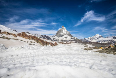 Snow covered mountain against sky