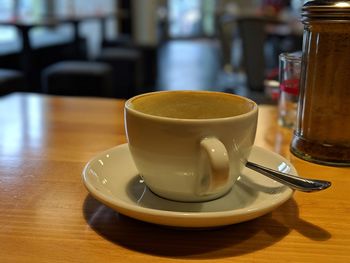 Close-up of coffee cup on table