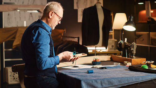 Side view of businessman working at office