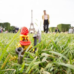Close-up of child on field against sky