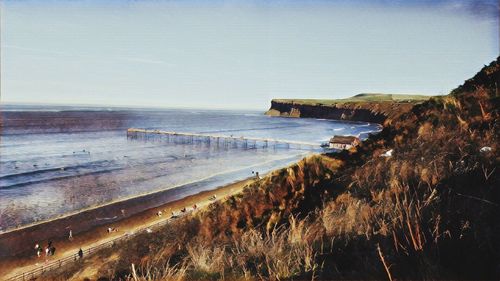 Scenic view of beach against clear sky