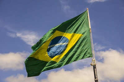 Low angle view of brazil flag against sky