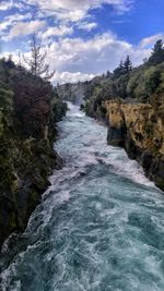 Scenic view of river flowing through rocks