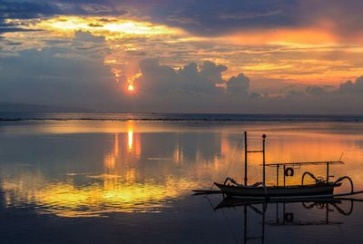 Scenic view of sea against sky at sunset