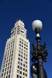 Low angle view of building against blue sky