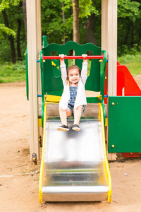 Full length of girl playing in playground