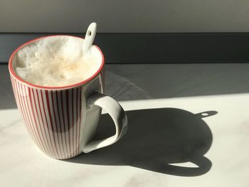 High angle view of coffee cup on table