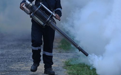 Fogging is done in residential areas affected by dengue fever.