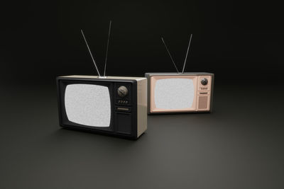 Close-up of camera against black background