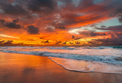 Scenic view of beach against sky during sunset
