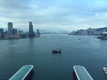 Scenic view of sea and buildings against sky