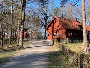 View of cottage amidst trees and building