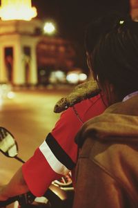 Rear view of man and woman with dog