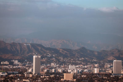 High angle view of buildings in city against sky