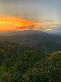 Scenic view of landscape against sky during sunset