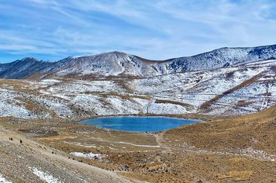 Scenic view of snowcapped mountains and lake against sky