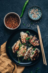 High angle view of dumplings in plate on table