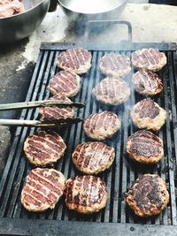 High angle view of meat on barbecue