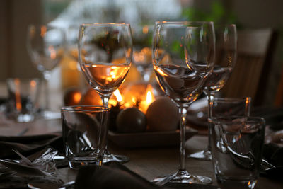 Close-up of wine glasses on table