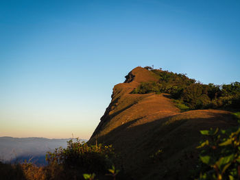 Scenic view of mountains against clear blue sky