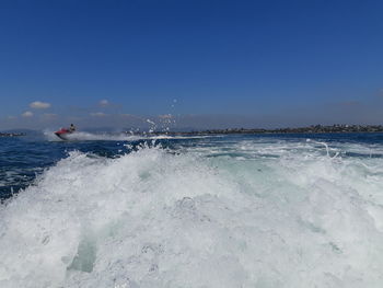 Scenic view of sea against clear blue sky