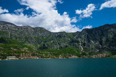 Scenic view of mountains against cloudy sky