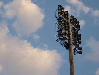 Low angle view of floodlight against sky