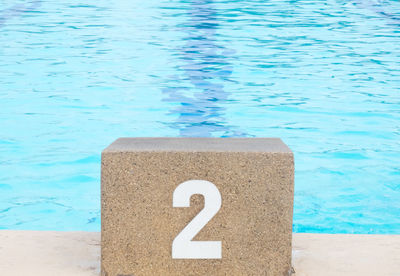 High angle view of warning sign on swimming pool