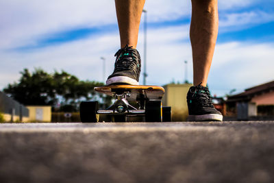 Low section of man skateboarding