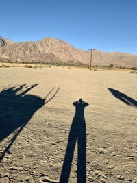 Shadow of man on desert