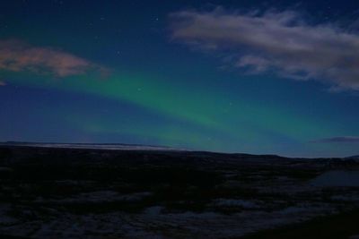 Scenic view of landscape against sky at night