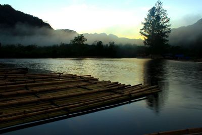 Scenic view of lake against sky during sunset