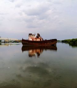 Built structure in sea against sky