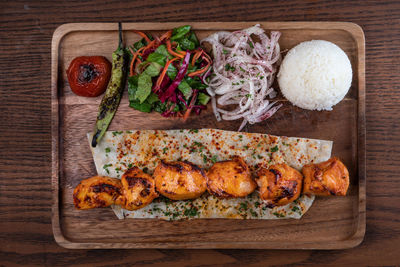 High angle view of meat on barbecue grill