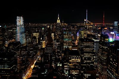 Illuminated buildings in city at night