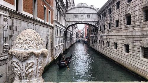 View of canal along buildings