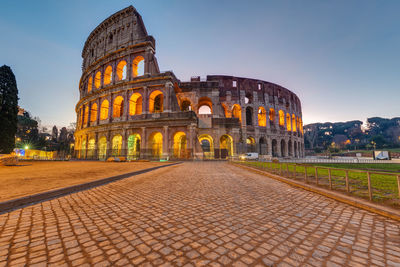 The imposing roman colosseum in rome before sunrise
